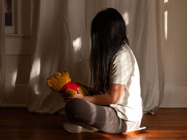 Alex Zhu and a stuffed Winnie the Pooh. The character is sometimes said to resemble Chinese leader Xi Jinping. Picture: Kaylee Greenlee for WSJ