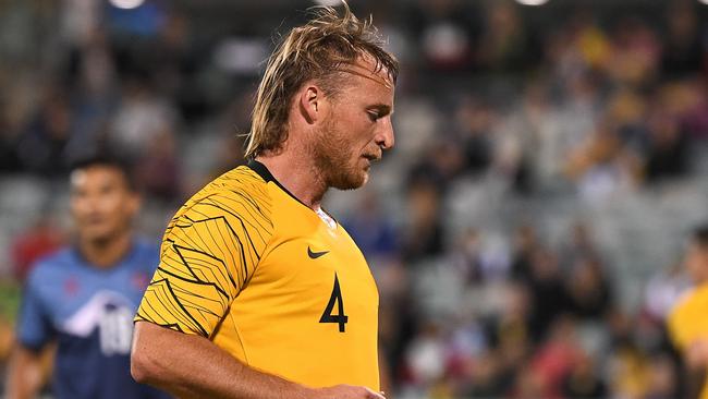 Rhyan Grant and his mullet are becoming a mainstay in the gold shirt. Picture: AAP