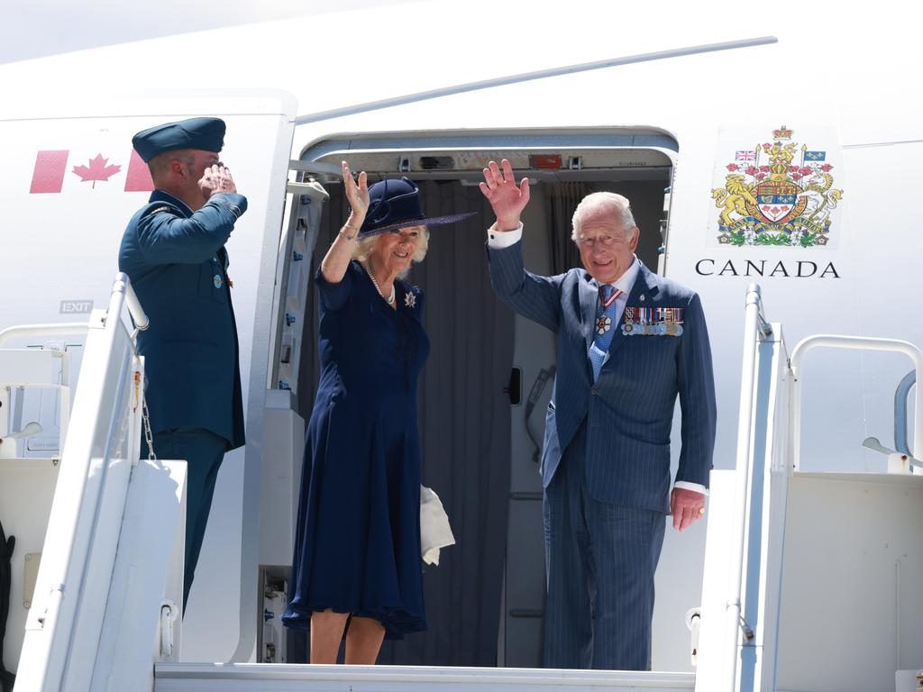 King Charles III and Queen Camilla wave goodbye as they enter the aeroplane at the end of an official visit to Canada. Picture: Getty Images