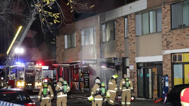 More than 20 firefighters battled the blaze, but the shop couldn’t be saved. Picture: Bill Hearne