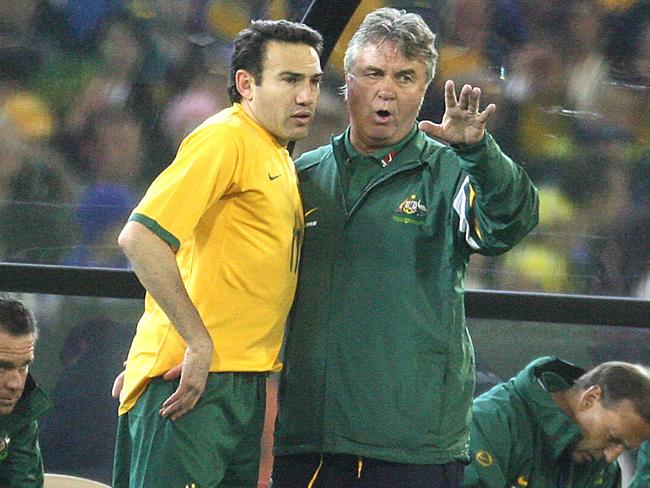 (L-R) Stan Lazaridis talks with coach Guus Hiddink.