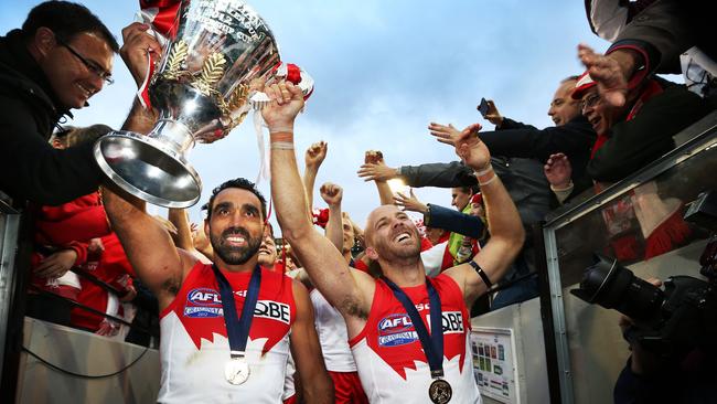 Adam Goodes and Jarrad McVeigh of the Sydney Swans celebrates with the cup after the Swans won the 2012 AFL Grand Final. Picture: Phil Hillyard