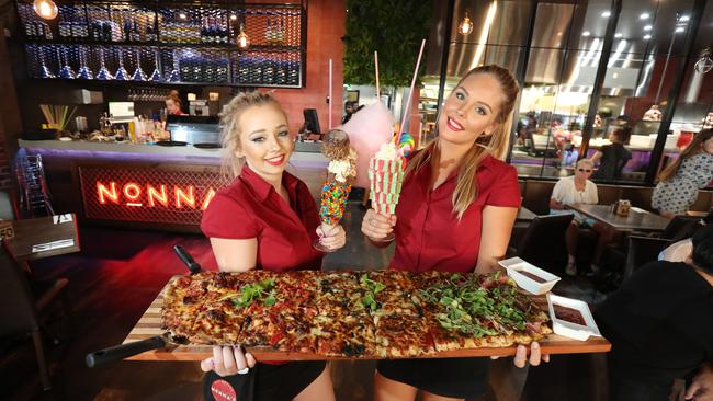 Nonna's do a 1m pizza! Rebecca Kilgour (L) and Emma Blackwood show off a 1m creation. Picture: Richard Gosling