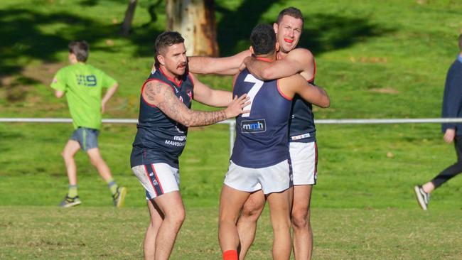 Pooraka players celebrate a goal last season. Picture: AAP/Brenton Edwards