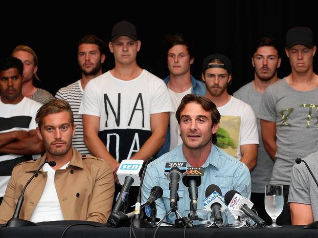 Jobe Watson, flanked by his team mates, talks to the media at the Pullman Hotel on March 31, 2015 after his players were found not guitly of taking a banned substance. Picture: Quinn Rooney/Getty Images.