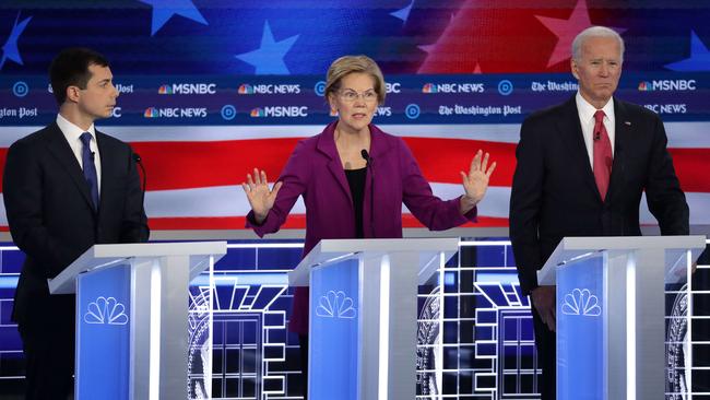 Senator Elizabeth Warren is flanked by Indiana Mayor Pete Buttigieg, left, and former Vice President Joe Biden during the Democratic Presidential Debate in Atlanta, Georgia. Picture: Getty Images