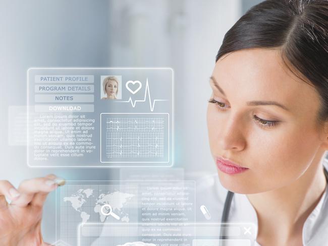 Calm doctor touching a medical interface in the hospital