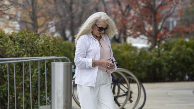 Sharon Ann Stott, 58, arrives at ACT Supreme Court during her trial over an alleged baseball bat stand over job.