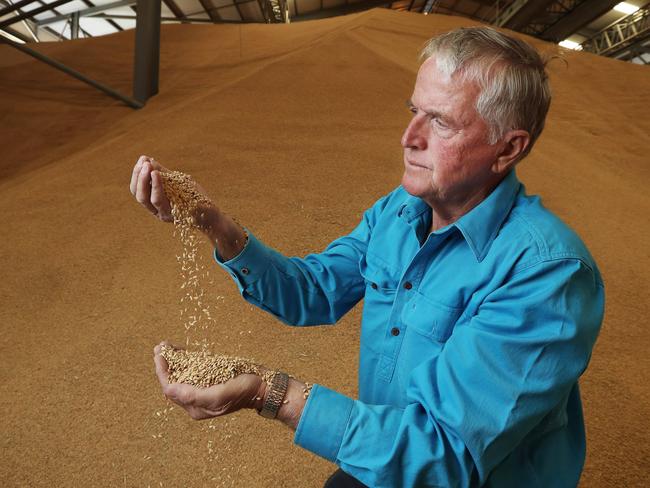 11/12/19: Moulamein rice grower and SunRice chairman Laurie Arthur with some of his rice at the Deniliquin rice mill. John Feder/The Australian.