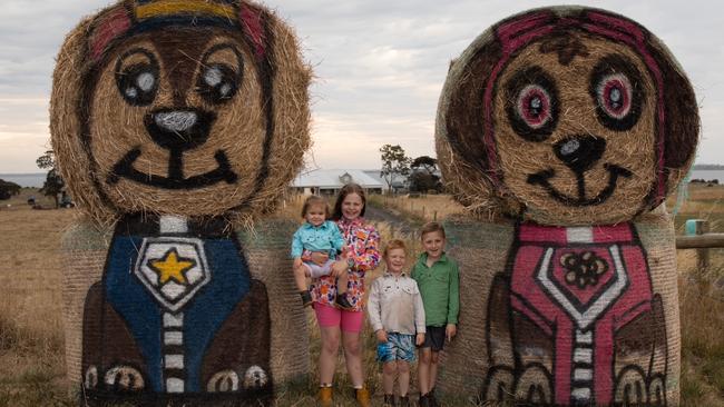 Piper Burns, 1, Isabelle Cartledge, 10, Harvey Burns, 4, and Levi Beatty-Burns, 7, with their Paw Patrol-themed hay bale decorations. Picture: Supplied by Holly Bray-Low