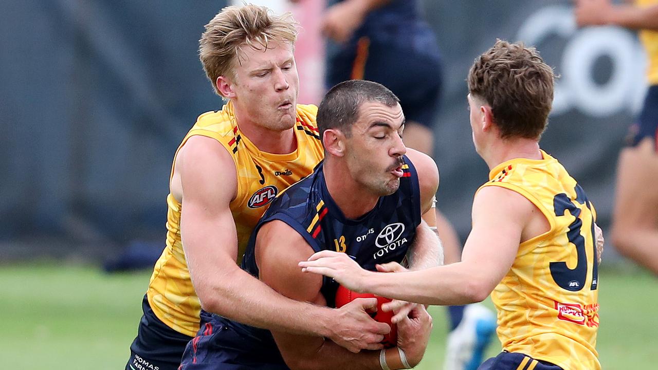 Fischer McAsey tackles teammate Taylor Walker at training. Picture: Sarah Reed