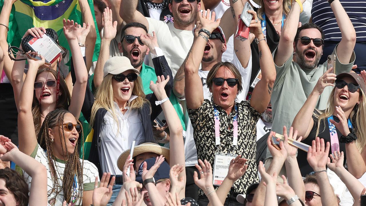 Spot the Aussie icons: Nicole and Keith blend into the crowd. Picture: Adam Head