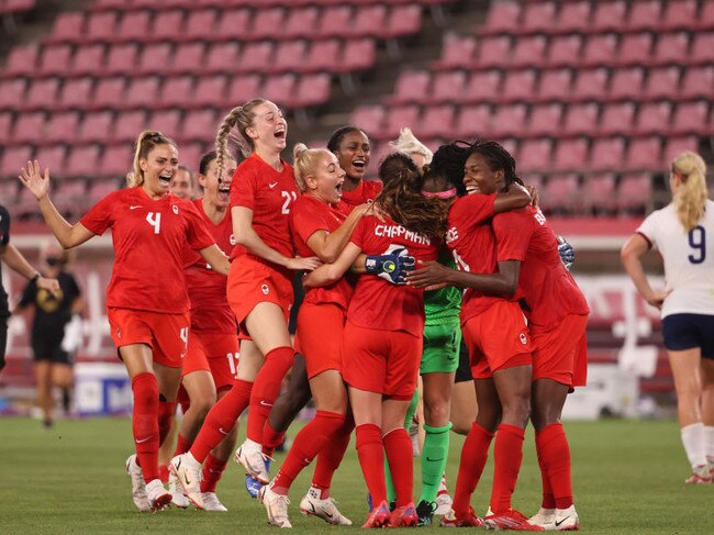 Team Canada celebrate their side's victory after the women's semi-final match with USA. Picture: Atsushi Tomura/Getty Images