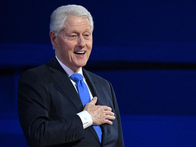 (FILES) Former US President Bill Clinton gestures as he arrives to speak on the third day of the Democratic National Convention (DNC) at the United Center in Chicago, Illinois, on August 21, 2024. Former US President Bill Clinton has been hospitalized with a fever, an aide to the former president announced on December 23, 2024. (Photo by Alex WROBLEWSKI / AFP)