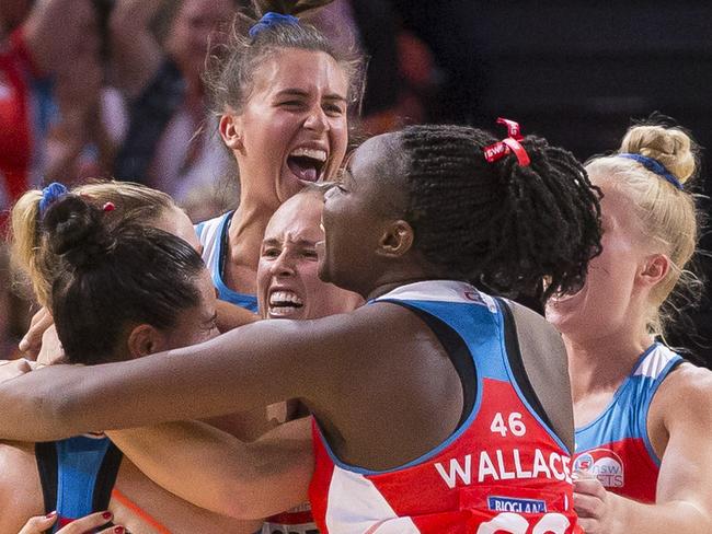 NSW Swifts celebrate their win after the Super Netball Round 1 match between the NSW Swifts and the Queensland Firebirds at Qudos Bank Arena, Sydney Olympic Park, Sunday, April 29, 2018. (AAP Image/Craig Golding) NO ARCHIVING, EDITORIAL USE ONLY