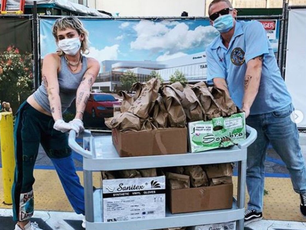 Miley Cyrus and Cody Simpson broke their coronavirus quarantine to deliver tacos to local healthcare workers in California. Picture: Instagram