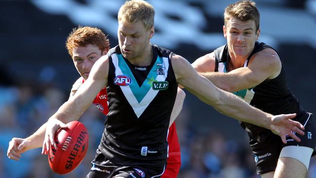 Kane Cornes in action for Port Adelaide in a match against the Swans.