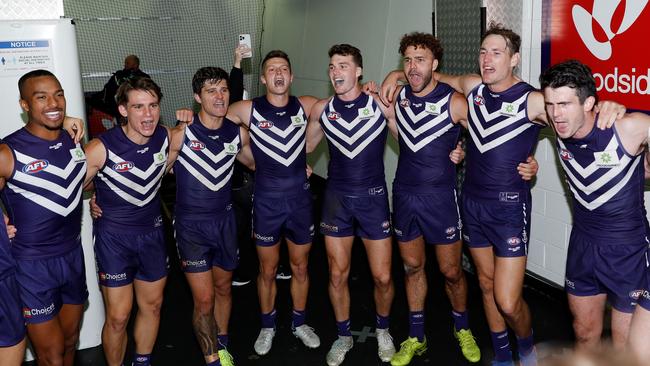 Fremantle players belt out the song after beating Geelong. Picture: Dylan Burns/AFL Photos via Getty Images)