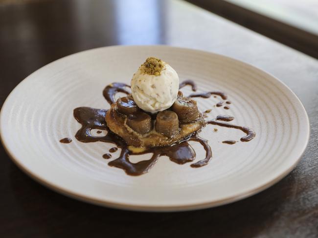 Balanced: caramelised banana upside-down tart with maple pecan ice-cream at the Port Office Hotel, Brisbane City. Picture: Mark Cranitch