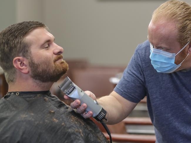 A man gets a shave when barber shops reopened in Atlanta. Picture: AP