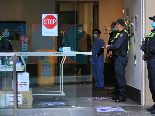 Police and staff at one of Melbourne’s quarantine hotels. Picture: Aaron Francis