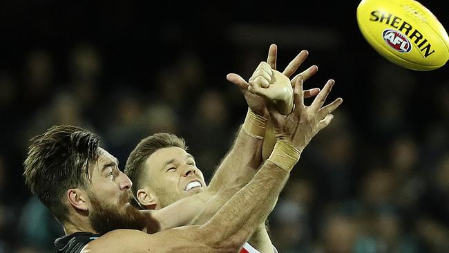 Logan Austin in a marking contest with Port Adelaide’s Charlie Dixon.