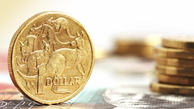 Aussie one dollar coins, on a twenty dollar note.