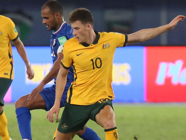 Australia's midfielder Ajdin Hrustic (R) vies for the ball with Kuwait's midfielder Bader al-Motawaa during the 2022 FIFA World Cup qualification group B football match between Australia and Kuwait at the Jaber Al-Ahmad Stadium in Kuwait City on June 3, 2021. (Photo by Yasser Al-Zayyat / AFP)