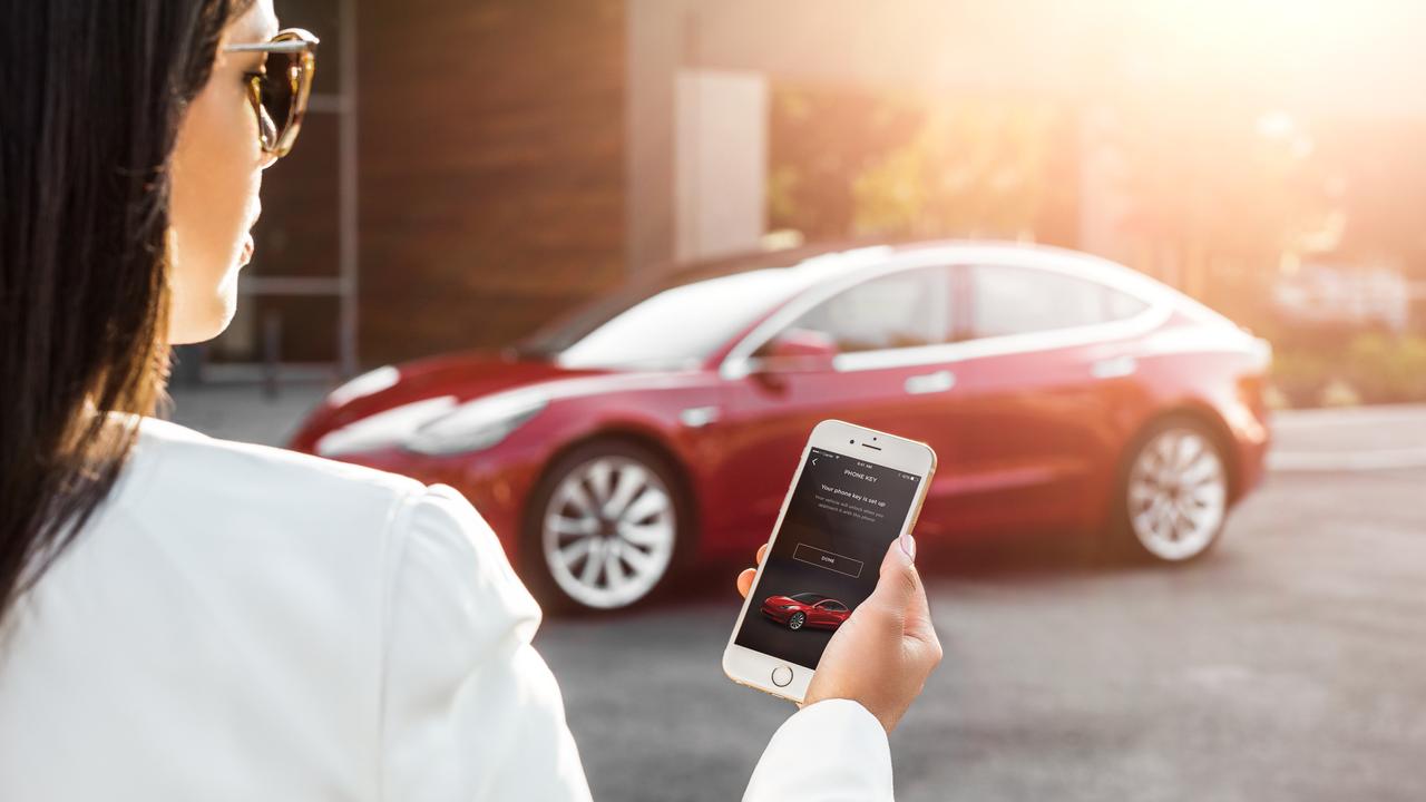 Smartphone enthusiasts are drawn to electric cars such as the Tesla Model 3.