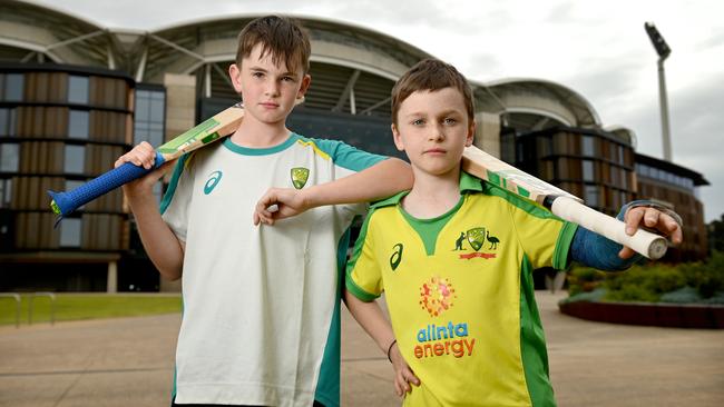 Cricket fans Noah Taylor, 10 and Jonah Siddons, 8, may miss out on seeing the Test at Adelaide Oval because crowd numbers have been capped. Picture: Naomi Jellicoe