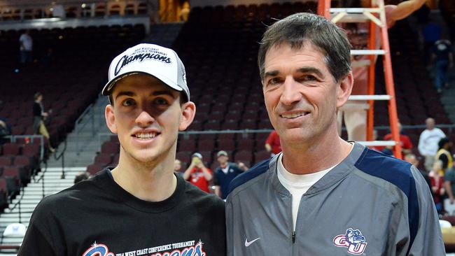 David Stockton poses with his father, former NBA player John Stockton, in 2014.