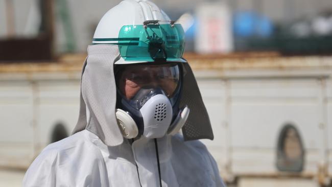 OKUMA, JAPAN - FEBRUARY 24: (EDITOR'S NOTE: This image has been digitally altered to protect employee privacy rights.) Workers continue the decontamination and reconstruction process at the Tokyo Electric Power Co.'s embattled Fukushima Daiichi nuclear power plant on February 25, 2016 in Okuma, Japan. March 11, 2016 marks the fifth anniversary of the magnitude 9.0 earthquake and tsunami which claimed the lives of 15,894, and the subsequent damage to the reactors at TEPCO's Fukushima Daiichi Nuclear Power Plant causing the nuclear disaster which still forces 99,750 people to live as evacuees away from contaminated areas. (Photo by Christopher Furlong/Getty Images)