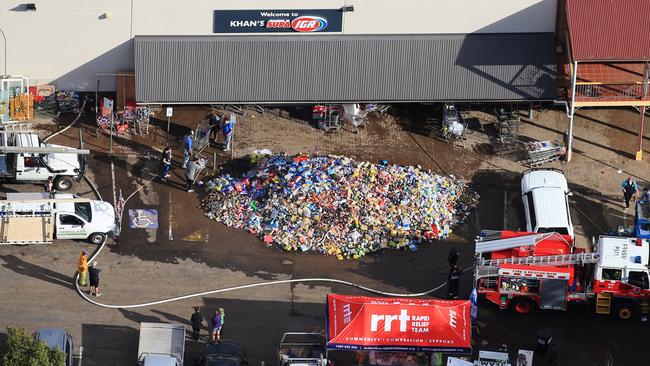 Spoiled stock piled up outside the IGA supermarket. Picture: Toby Zerna