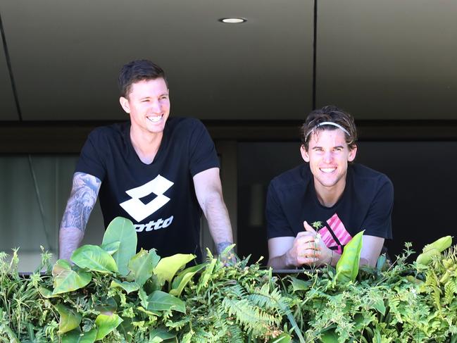 World no.3 Dominic Thiem (right) is seen on the balcony of his room at the Magestic Suites on Tynte Street in North Adelaide. Picture: NCA NewsWire / Dean Martin