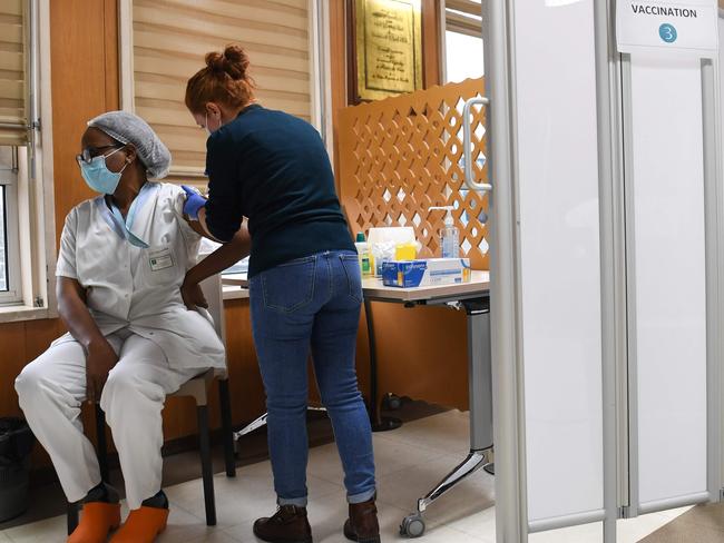 A health worker is vaccinated with the AstraZeneca/Oxford COVID-19 vaccine. Picture: AFP.