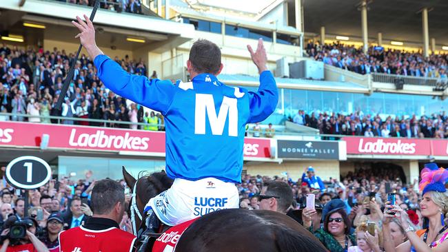 Hugh Bowman returns to scale after the mighty win. Picture: Ian Currie