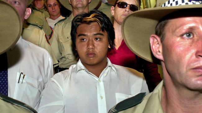 Phu Ngoc Trinh is taken through Darwin Airport following his arrest.