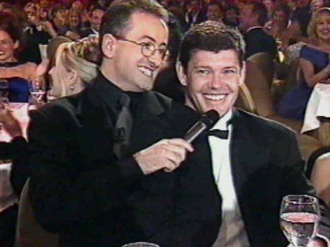 Andrew Denton sitting on James Packer's knee at 1999 awards.