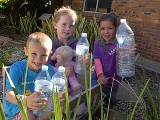 RAISING MONEY: Heath Heinemann, Aubree Davis and Savannah Daly help to recycle at Goodstart Early Learning, by donating bottles to the Container Exchange. Picture: Jorja McDonnell