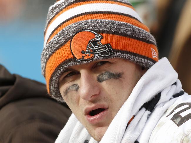 FILE - In this Sunday, Dec. 21, 2014, file photo, Cleveland Browns quarterback Johnny Manziel (2) sits on the bench during the second half of an NFL football game against the Carolina Panthers in Charlotte, N.C. An advisor for Manziel said in a statement released by the team Monday, Feb. 2, 2015, that Manziel has decided to enter treatment for an unspecified condition. (AP Photo/Bob Leverone, File)