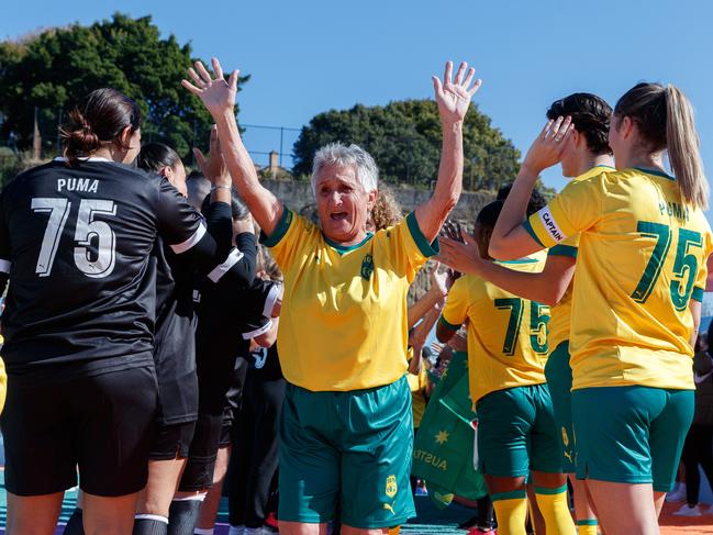 Trudy Fischer walks on to the field as some of original 1975 Matildas team reform for a rematch against New Zealand. Picture: David Swift