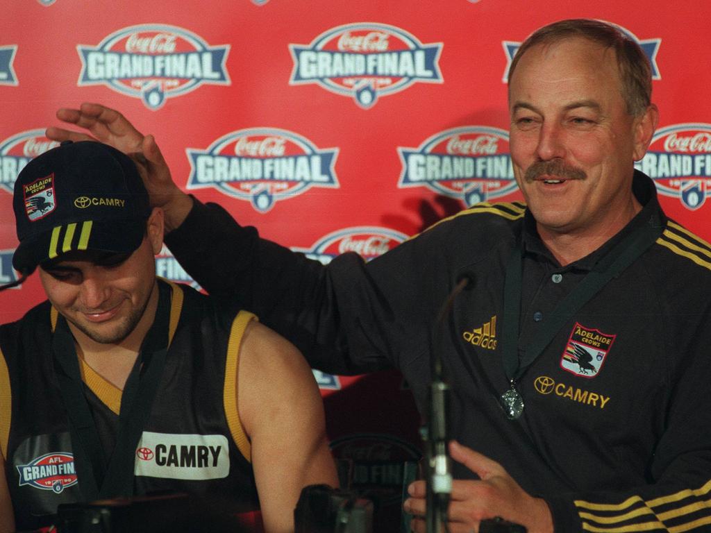 Crows coach Malcolm Blight praises the great work of Andrew McLeod, who collected his second Norm Smith Medal in the 1998 Grand Final against North Melbourne. Picture: Files