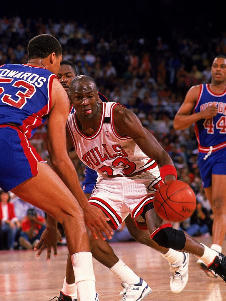 Michael Jordan of the Chicago Bulls takes on the Detroit Pistons during one of their torrid encounters.