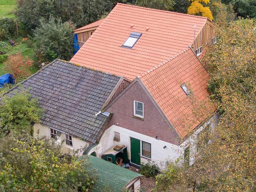 An aerial picture taken on October 15 shows a view of the farm where six children had been living in a small room. Picture: Wilbert Bijzitter/ANP/AFP