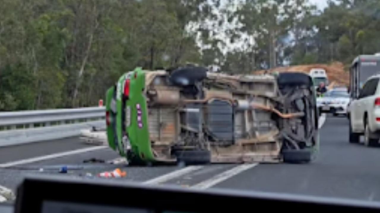 A Juicy campervan has rolled on its side following a two vehicle crash, closing the Bruce Highway.