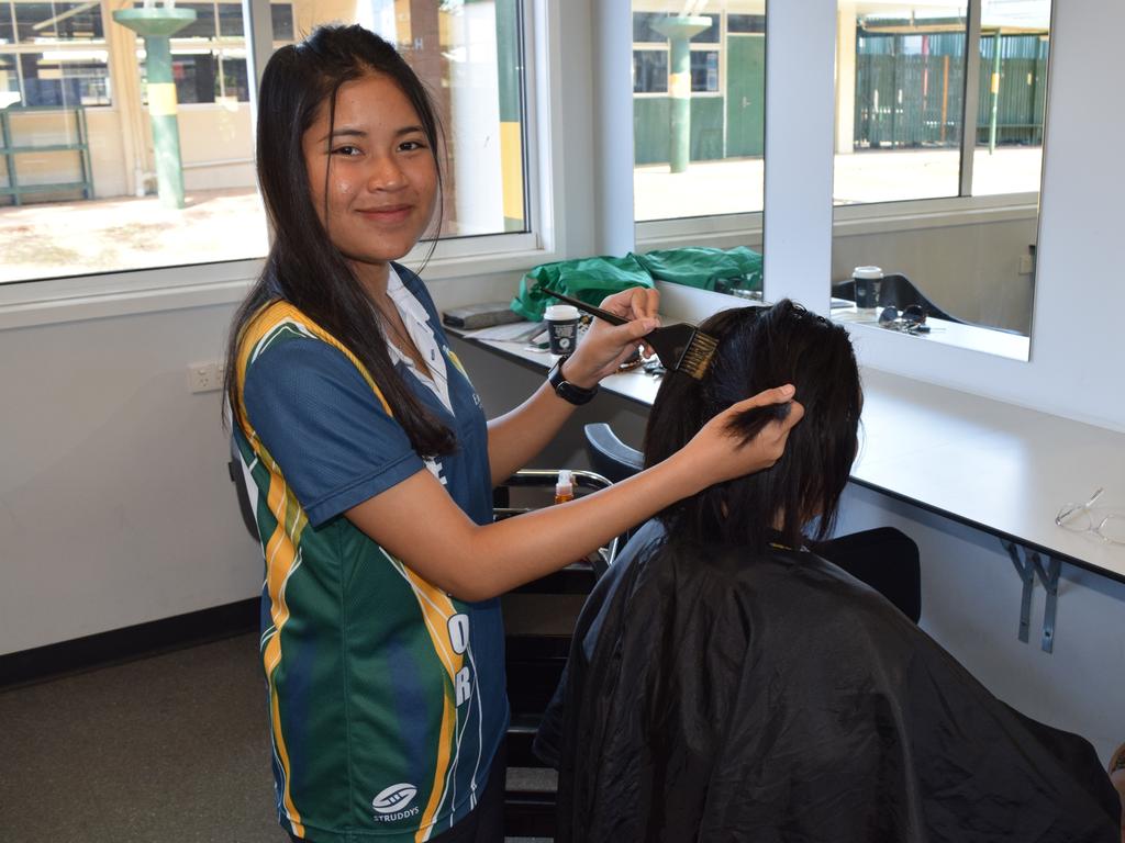 Netnapha (Earn) Sangjan working at the Styles and Smiles hair salon.