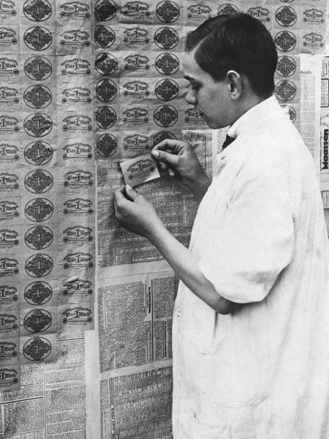 It was cheaper to paper a wall with Deutsche marks than it was to buy wallpaper. Picture: Hulton-Deutsch Collection/Corbis via Getty Images