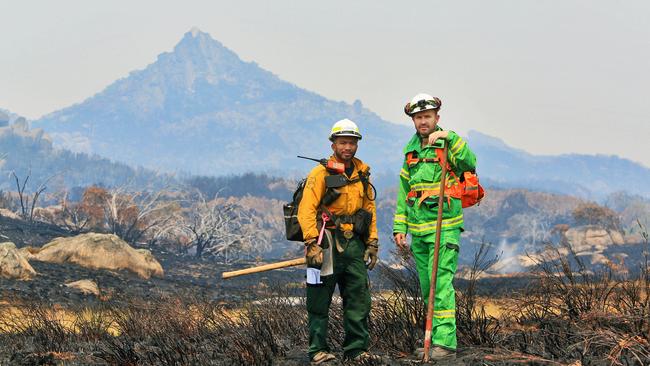 US firefighter Leonard Dimaculangan, left, with Luke Morrison from Forestry Fire Management Victoria at Mount Buffalo in the high country. Picture: Aaron Francis