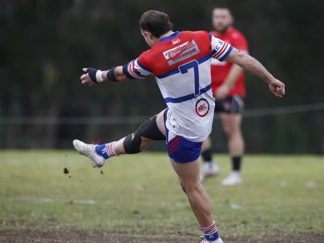 Cameron Williams kicks Emu Plains out of trouble. Picture Warren Gannon Photography