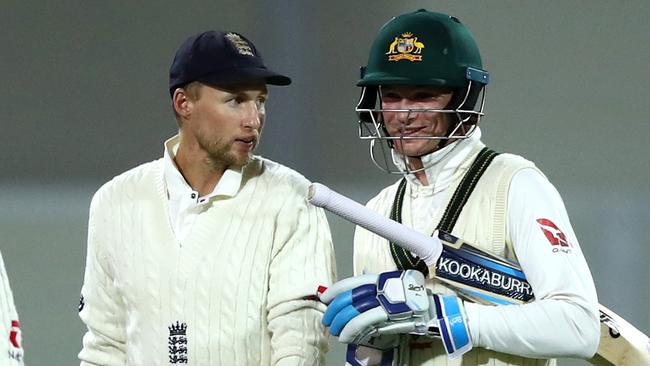 England captain Joe Root has a few words with Peter Handscomb as the players walk off Adelaide Oval. Picture: Getty Images